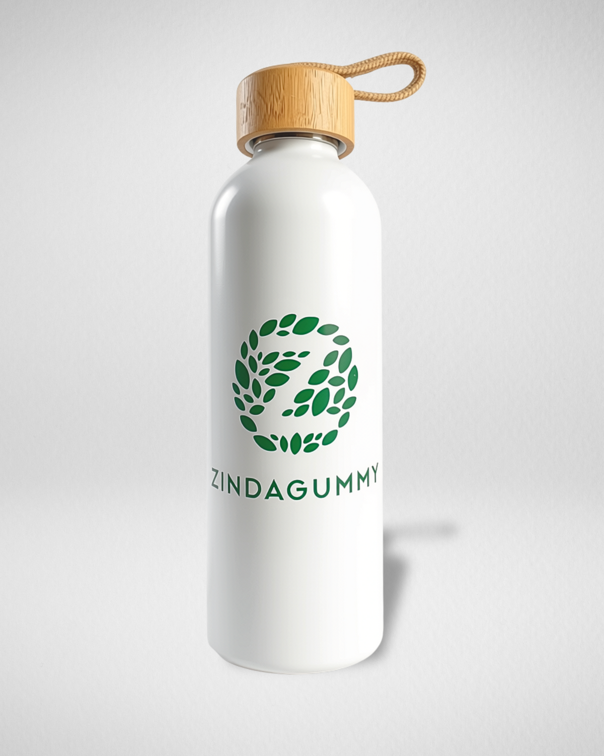 A white aluminum water bottle with a bamboo wood-grain lid and a green leaf logo that reads 'ZINDAGUMMY' on the front, set against a light gray background.