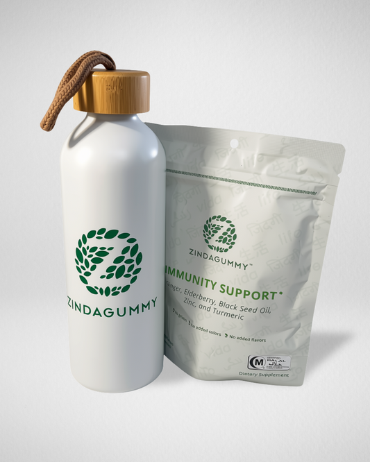 A white Zindagummy water bottle with a bamboo cap and brown loop, standing next to a white Zindagummy 'Immunity Support' supplement pouch on a light gray background.